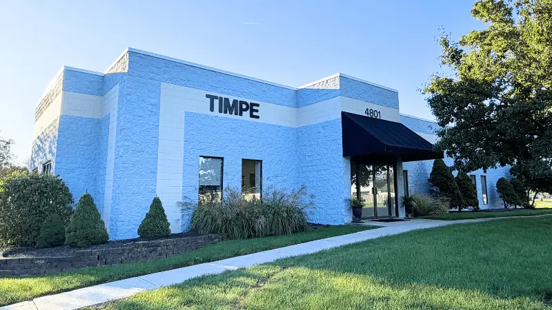 Exterior view of the light blue Timpe building with address 4801.